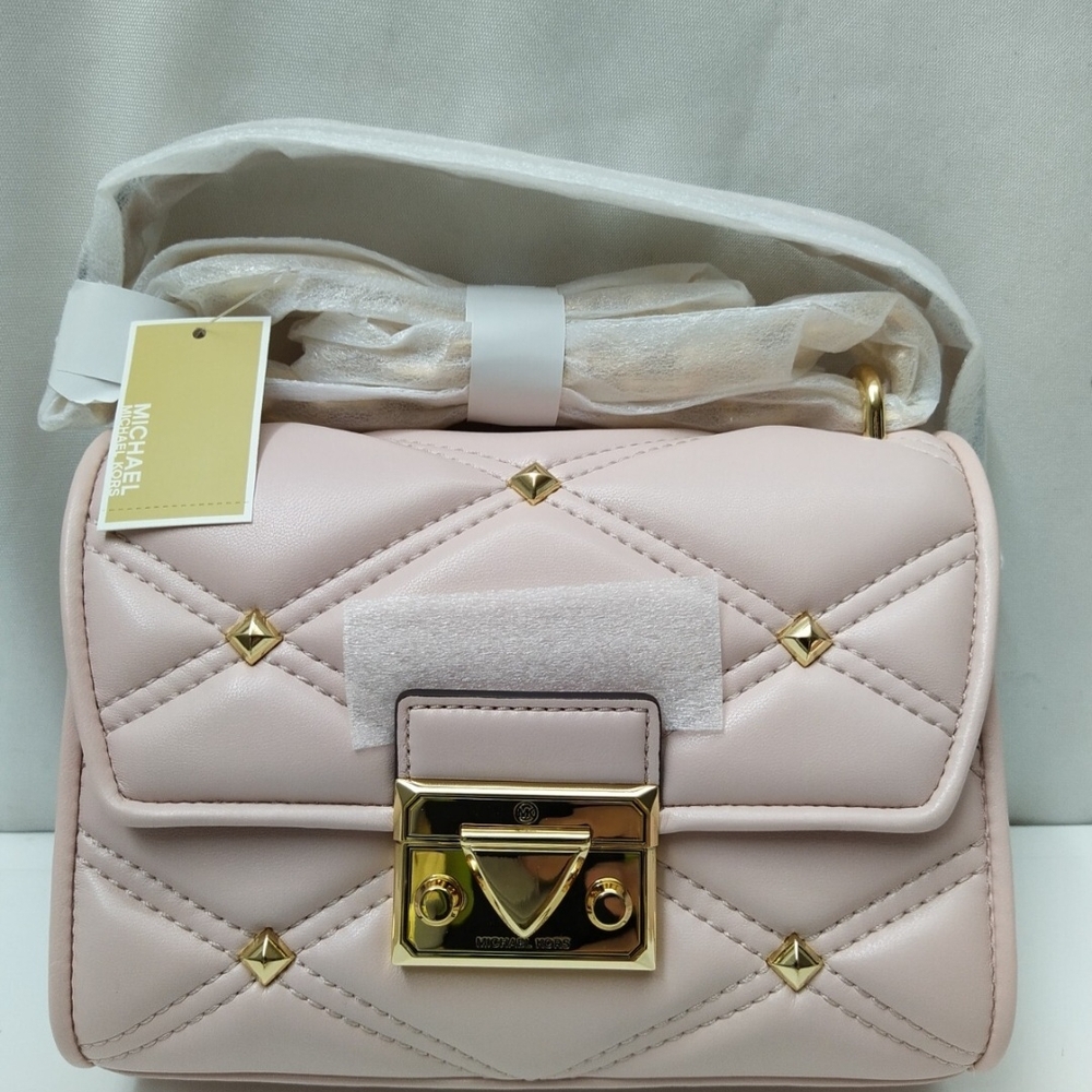 Michael Kors Pink and Gold Crossbody Bag with Flap Closure